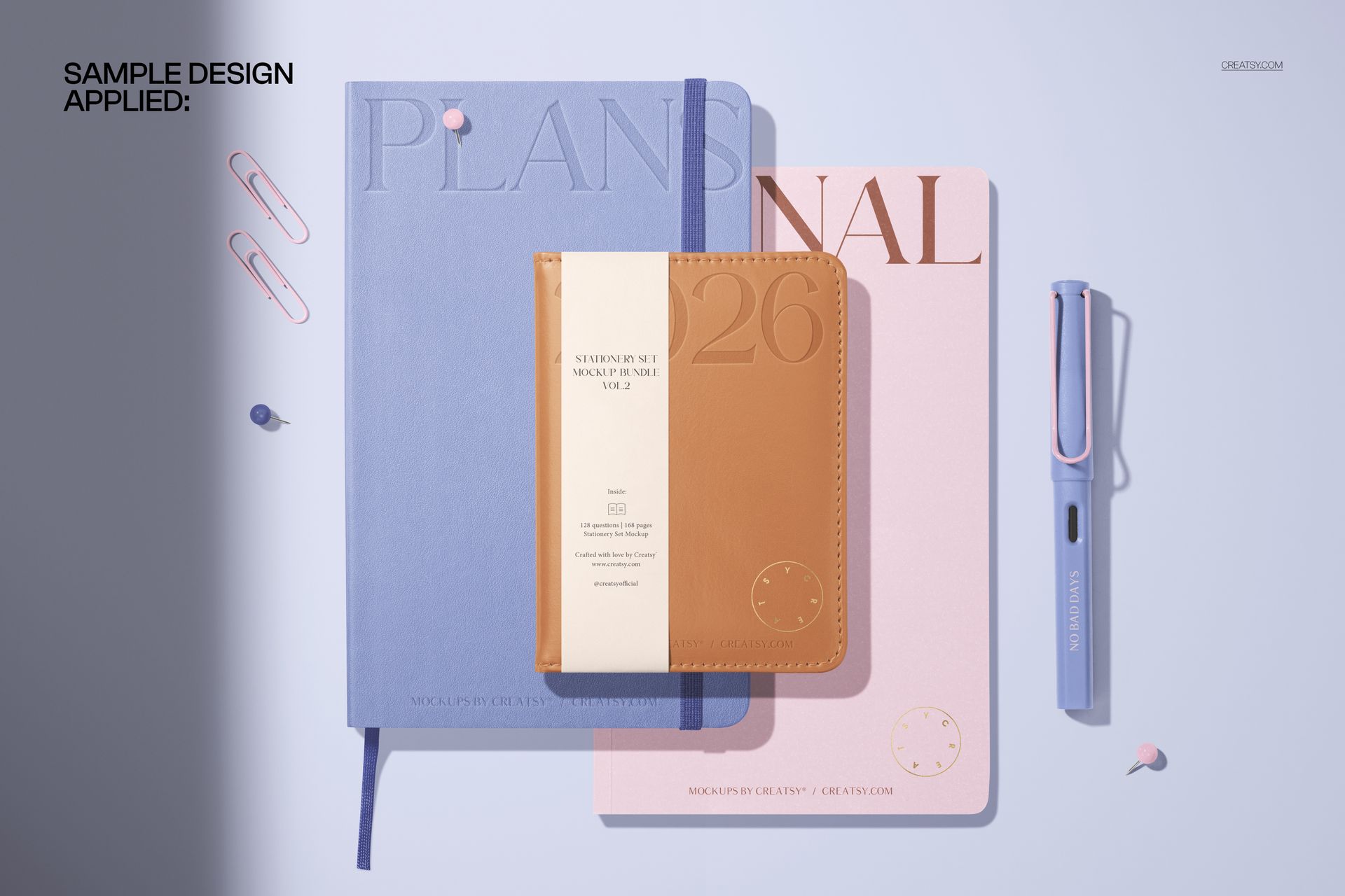 Flat lay of leather calendar and notebook mockup set with pastel blue, pink, and tan covers on a light surface.