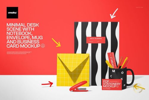 Top view of a stationery mockup with a wavy patterned notebook, yellow envelope, mug, and business card on a vibrant red surface.