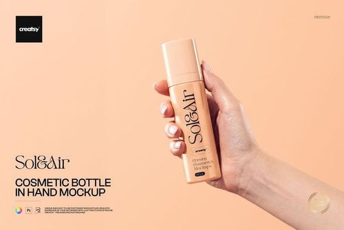 Hand holding a beige cosmetic bottle against a solid peach background, shown in a front view mockup scene.