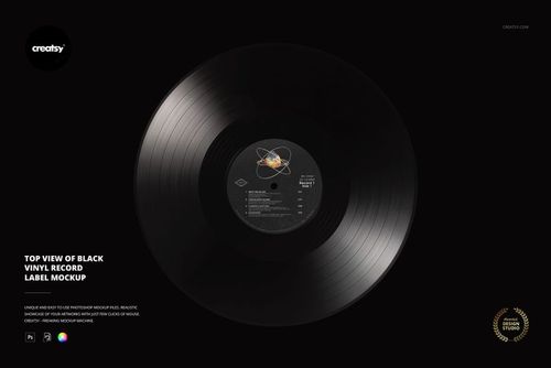 Top view of a black vinyl record with a detailed center label, set against a dark background for a music mockup.