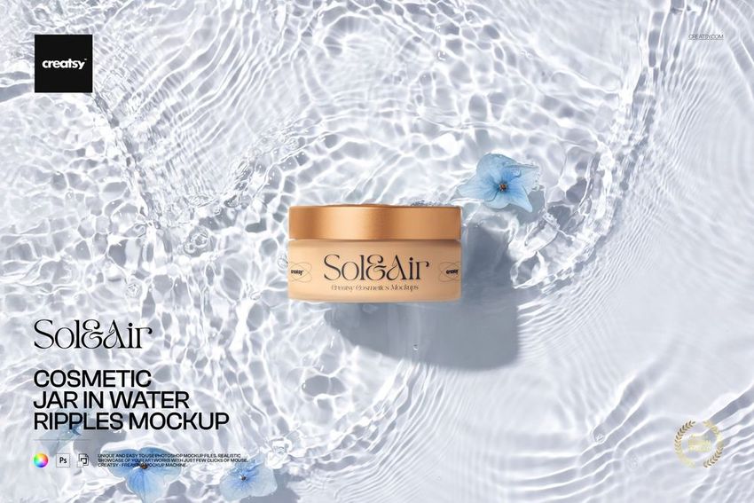 Frosted glass cosmetic jar with gold lid resting in clear water with ripples and blue flowers, top view mockup.