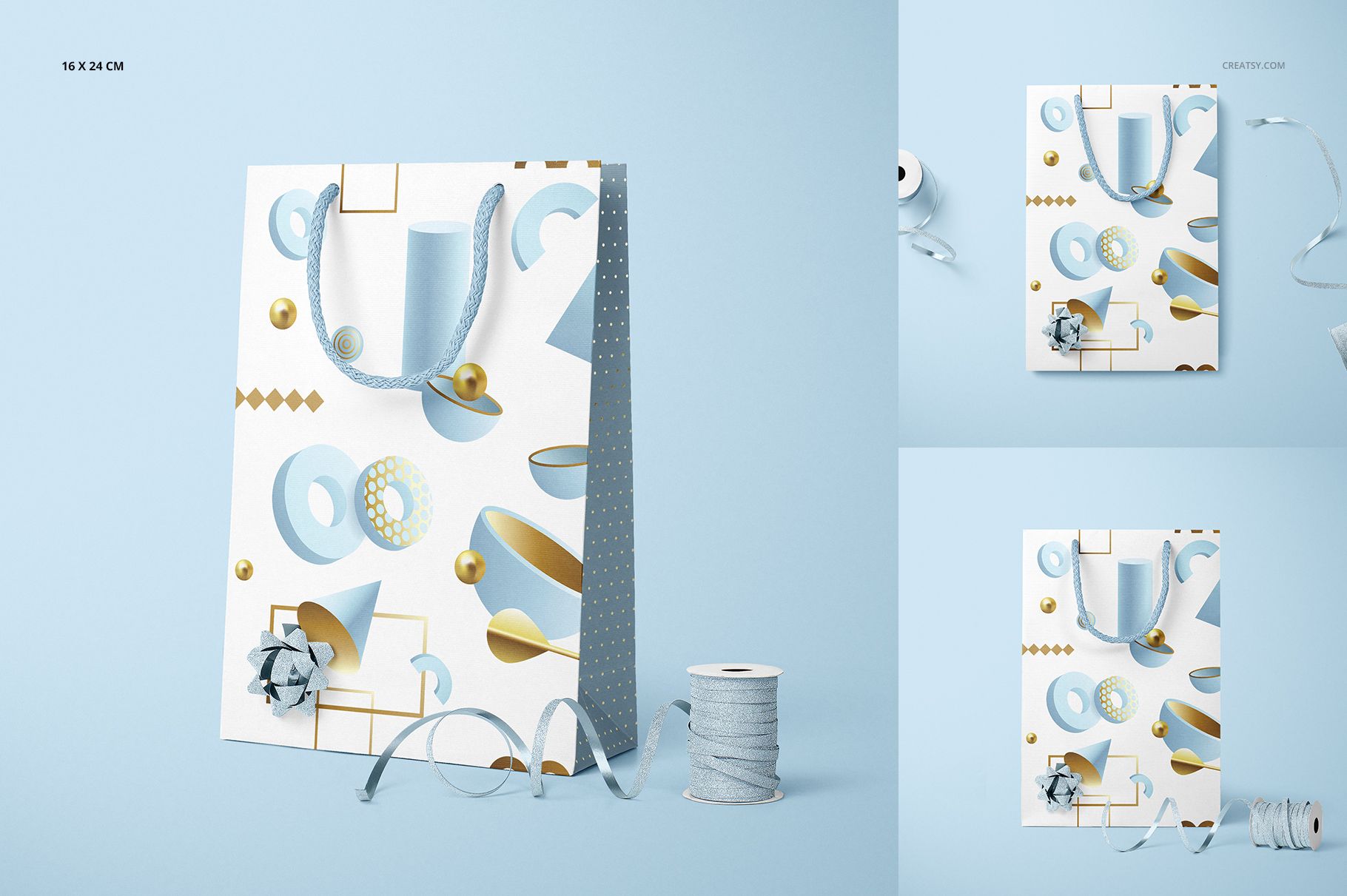 Paper bag mockup featuring a white surface with blue and gold shapes, silver rope handles, and a decorative bow.