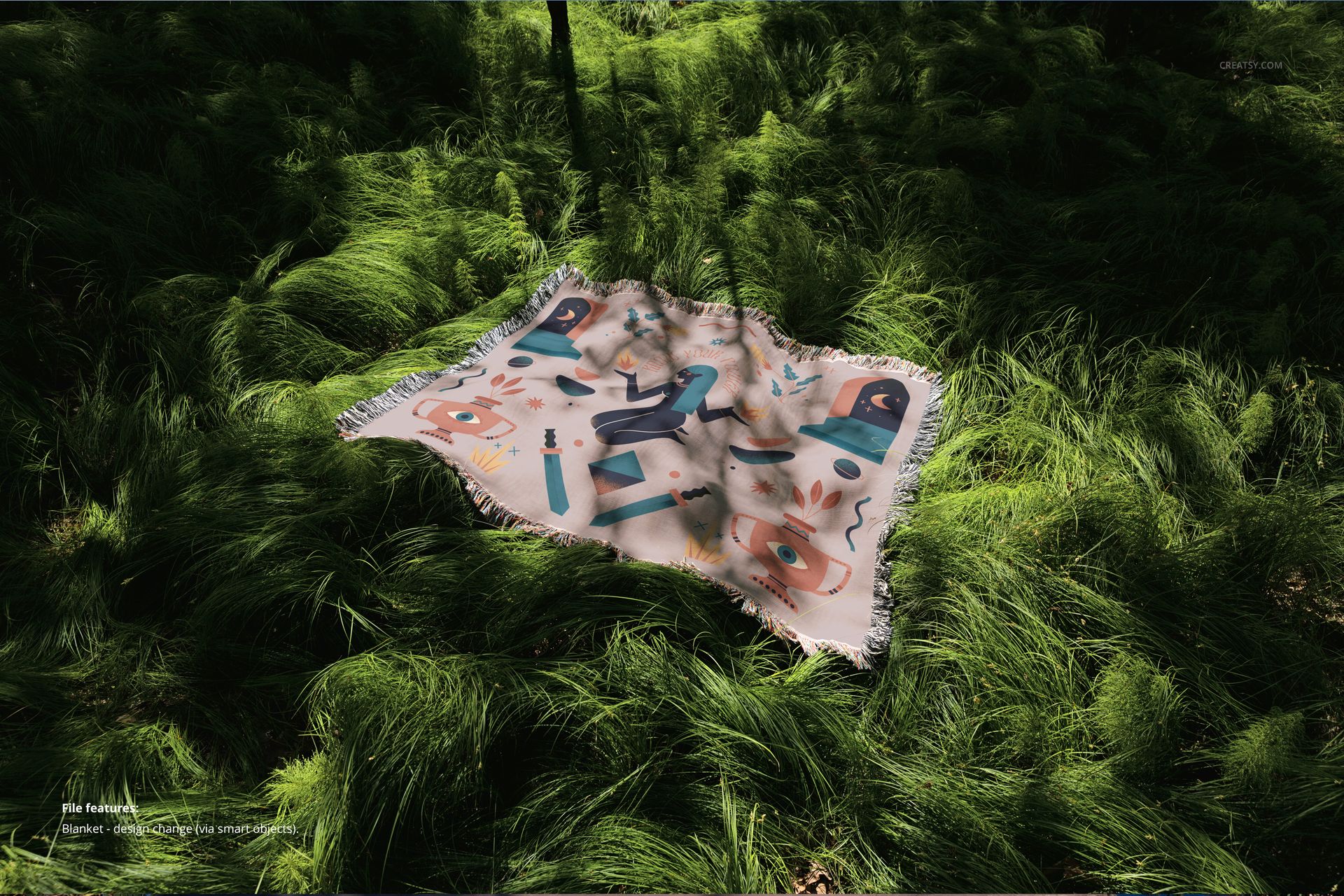 Fringed jacquard throw blanket mockup featuring a vibrant pattern, displayed on lush grass under dappled sunlight.