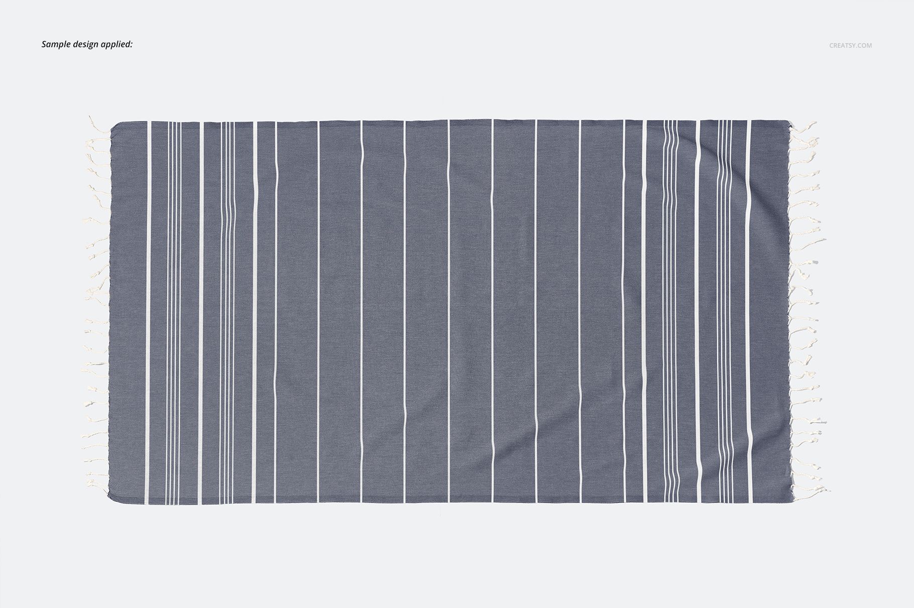 Gray Turkish towel mockup with white tassels and vertical stripe pattern, displayed flat against a light backdrop.