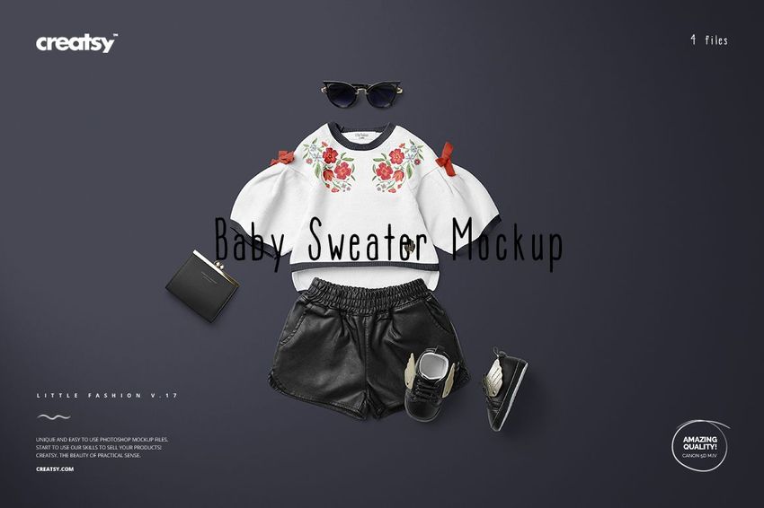 Front view of a baby sweater mockup with floral design, paired with black shorts, shoes, sunglasses, and wallet on dark background.