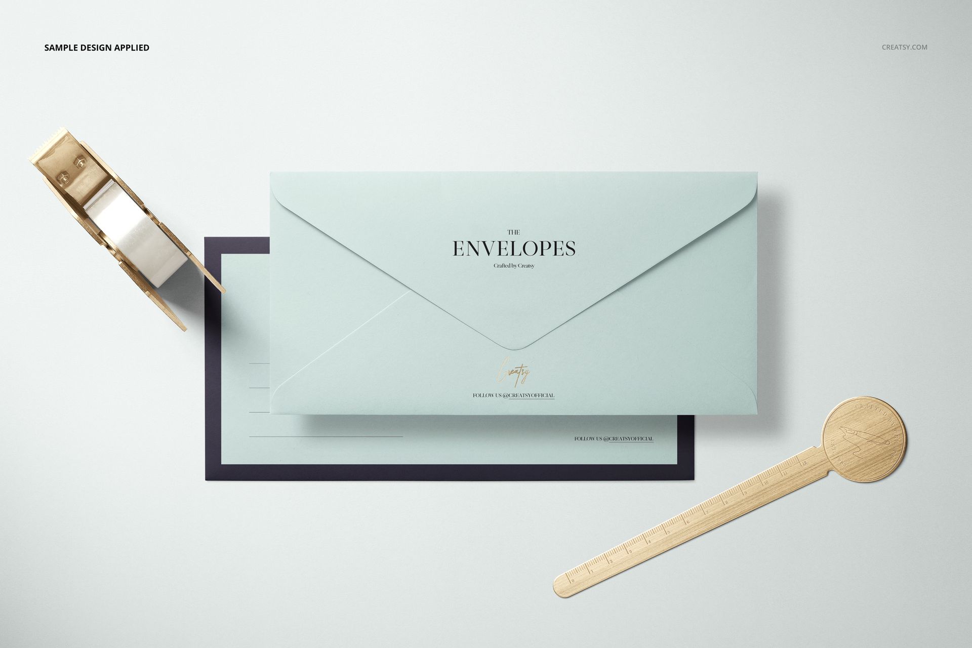 DL envelope mockup set featuring a light blue envelope with black trim, shown from a top view on a white surface.