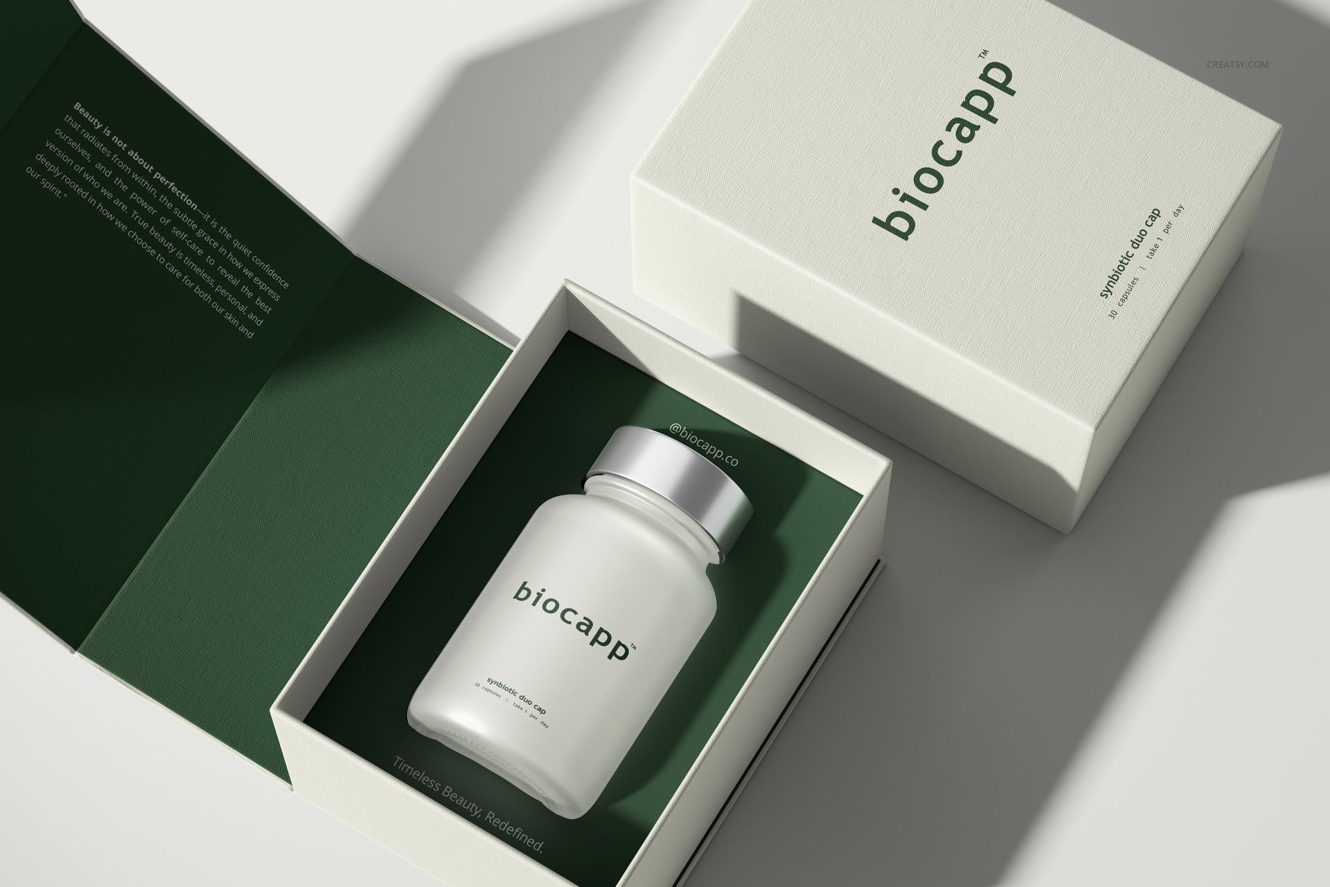 Cosmetics box packaging mockup featuring a frosted capsule bottle inside an open box with green interior lining.