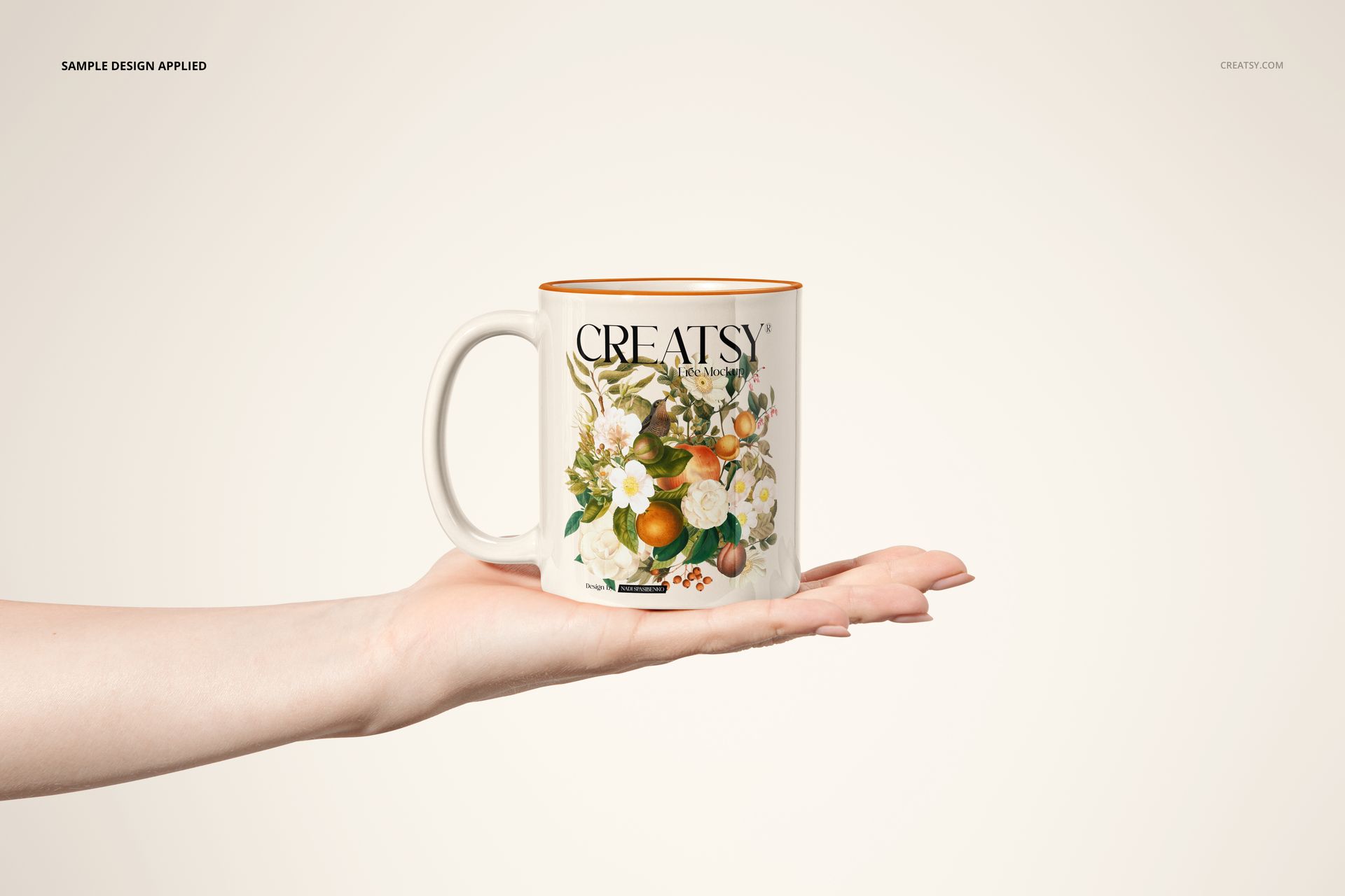 Front view of a sublimation coffee mug mockup featuring a botanical design, balanced on an outstretched hand.