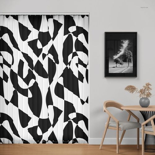 PSD mockup of vertical blinds featuring a striking black and white design beside a framed wall art and dining table.