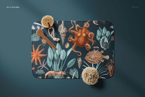 PSD mockup of a bath rug with aquatic-themed design, displayed flat with wooden brush and sponges on a dark background.