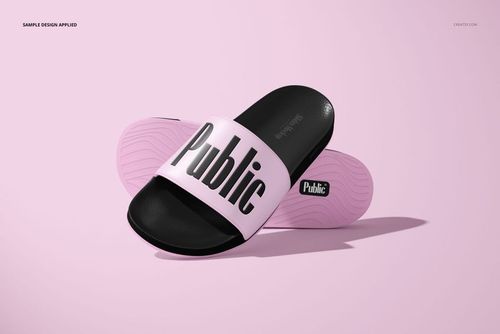 Slip-on slide sandals mockup featuring black soles and light pink straps with bold black text, shown on a pink surface.