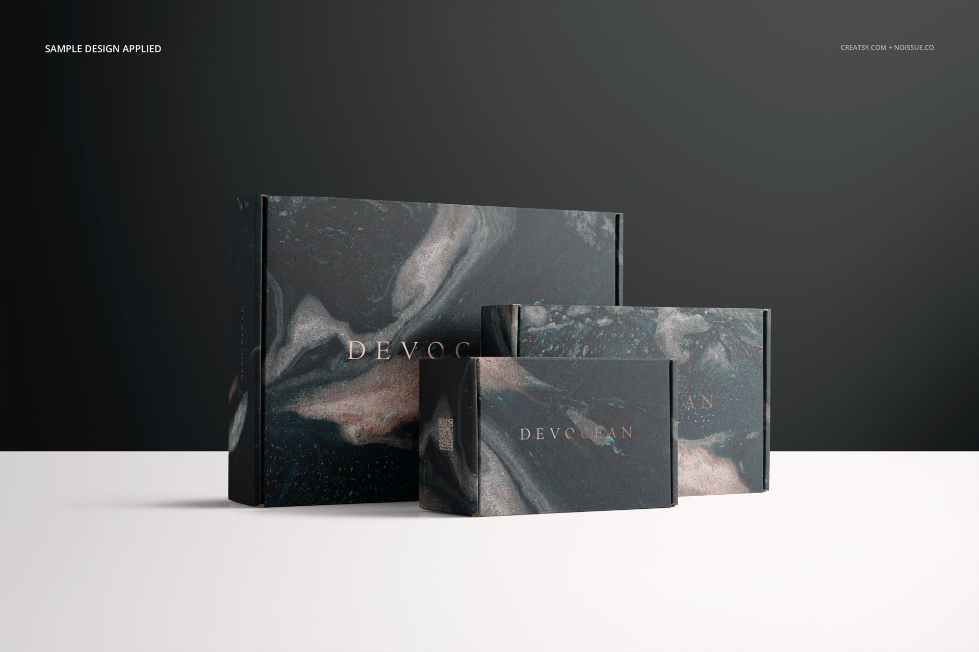 PSD mockup showing two mailing boxes in various sizes, both decorated with a swirling dark marble pattern and gold accents.