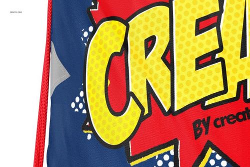 Detailed section of a drawstring backpack mockup featuring large yellow text and red graphic elements on blue fabric.
