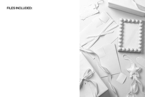 Top view of holiday packaging stationery mockup with blank gift tags, ribbons, and a decorative frame in white tones.