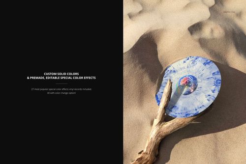 Blue and white marbled vinyl record mockup placed on sandy surface, supported by a weathered tree branch.