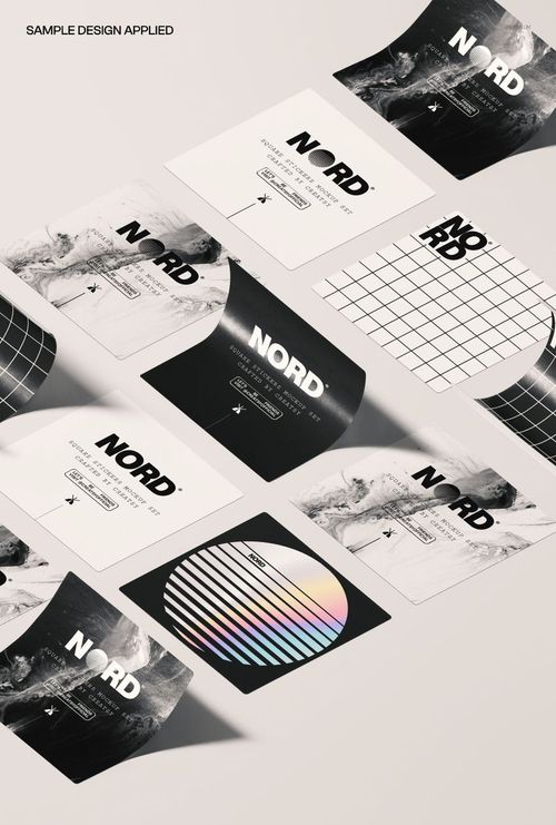 Overhead view of square sticker set mockup featuring various black, white, and grid designs on a light surface.