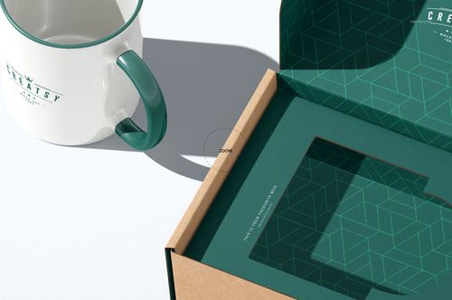 Insert tray generator mailing box mockup featuring an open cardboard box with patterned green interior and mug.