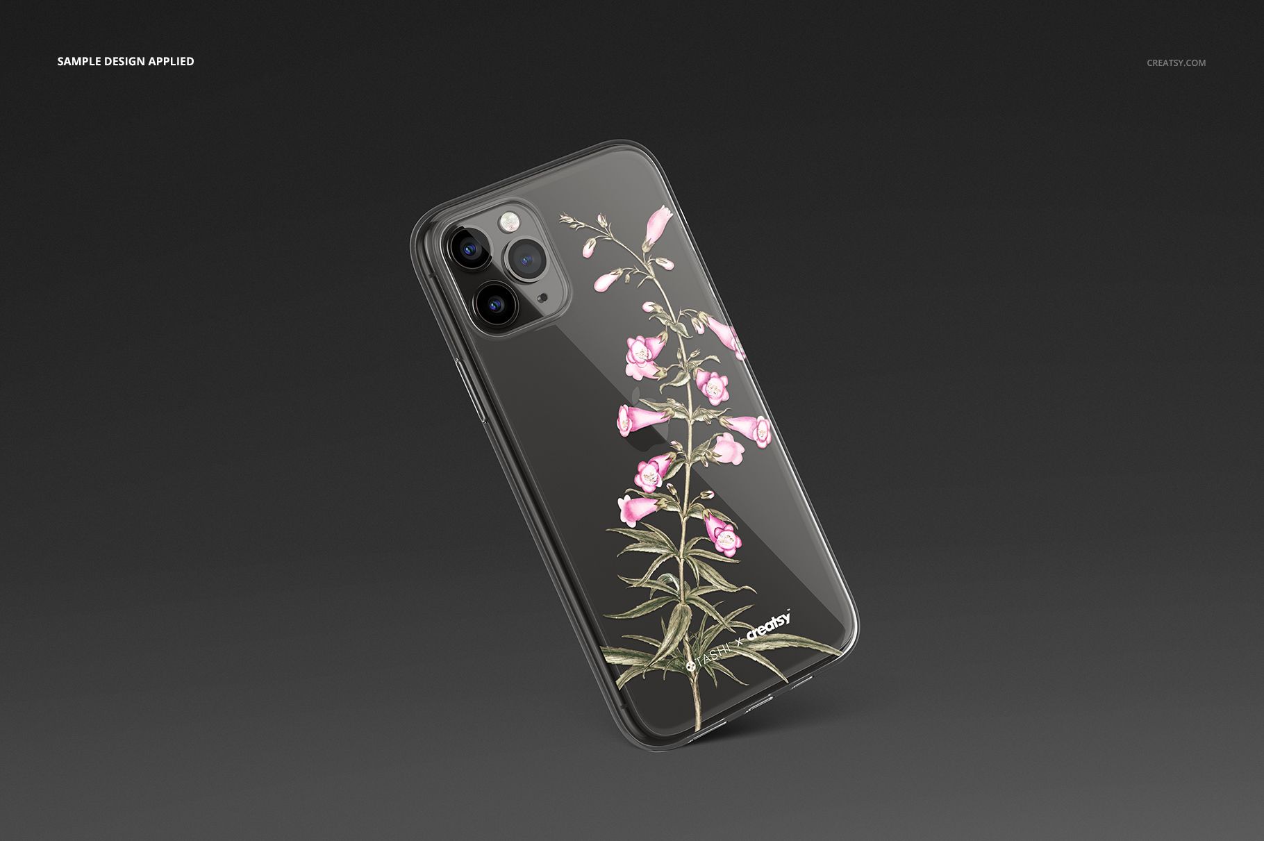 PSD mockup of an iPhone 11 Pro clear case with botanical artwork, set against a plain dark surface.