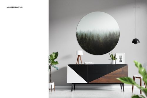 Circular metal print mockup featuring a forest design, displayed on a gray wall above a geometric sideboard.