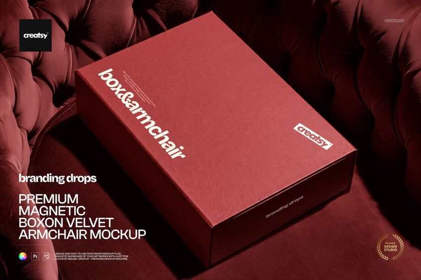PSD mockup of a red magnetic packaging box placed on a tufted velvet armchair, close-up perspective.