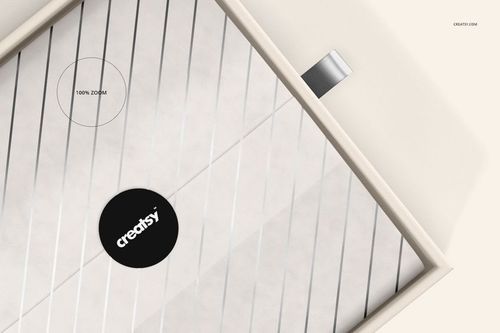 Top view of a rectangular gift box mockup with a diagonal striped pattern and a silver ribbon pull tab.