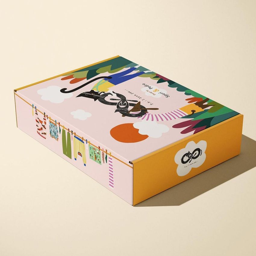 Colorful mailing box mockup with playful illustrated graphics, including animals, trees, and laundry on a pastel background.