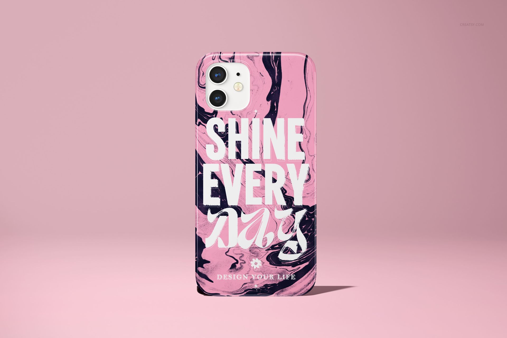 Front view of an iPhone 12 case mockup featuring a glossy finish, pink and black swirled design, and large white lettering.