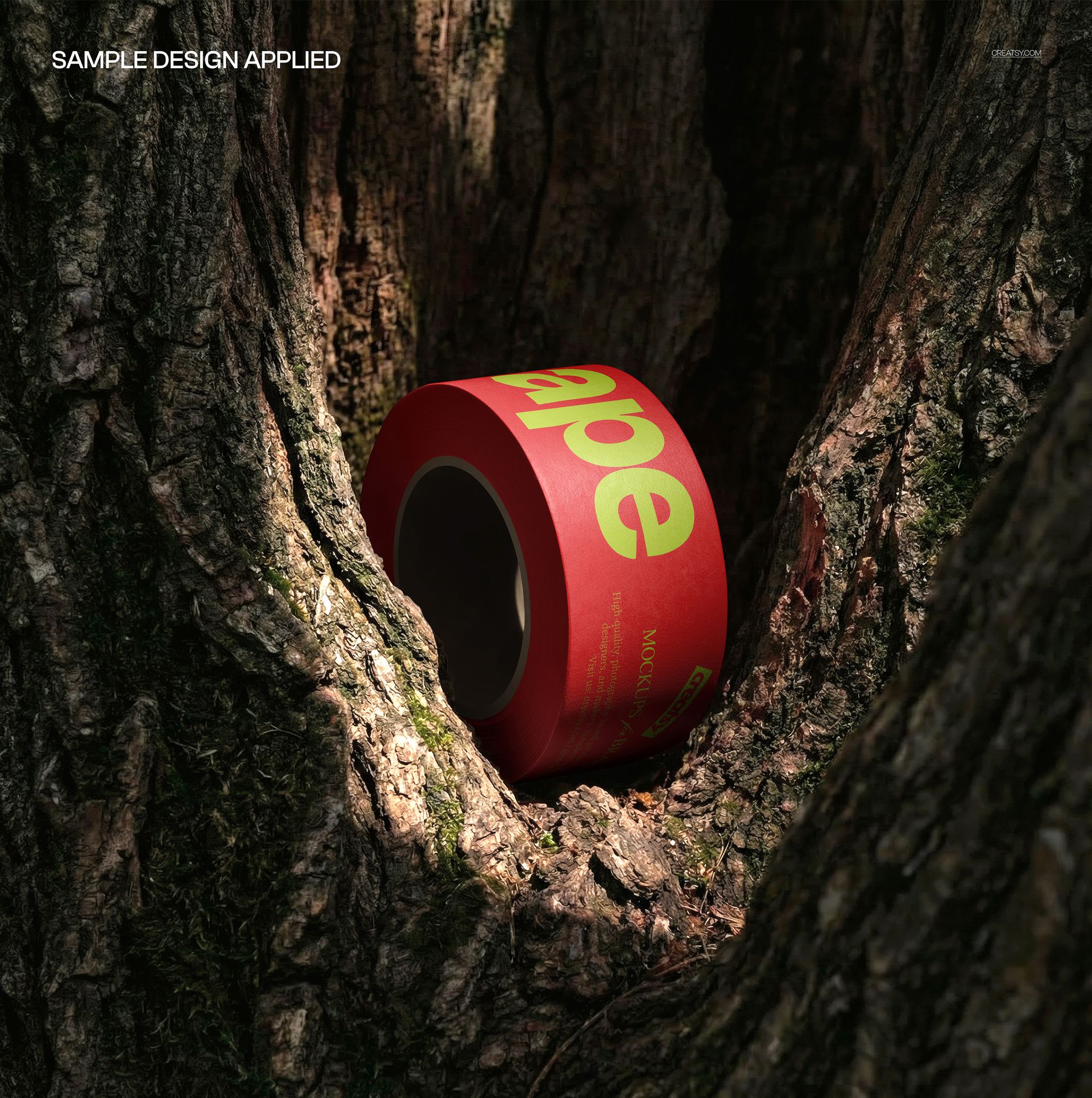 Red and green duct tape roll mockup placed in the crevice of rough tree bark, illuminated by natural light.