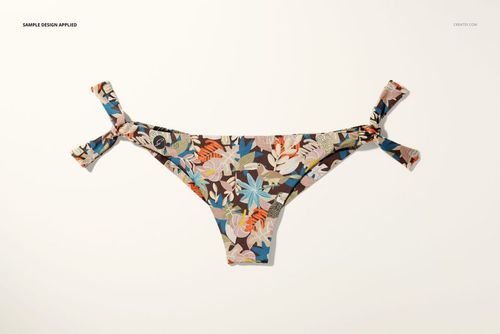 Front view of a bikini bottom mockup with side tie details, featuring a colorful floral pattern on a light background.