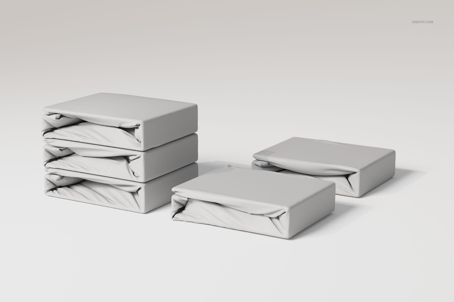 Stack of fitted bedsheet sets in light gray fabric, shown from a front angle on a plain white background.