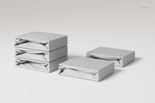 Stack of fitted bedsheet sets in light gray fabric, shown from a front angle on a plain white background.