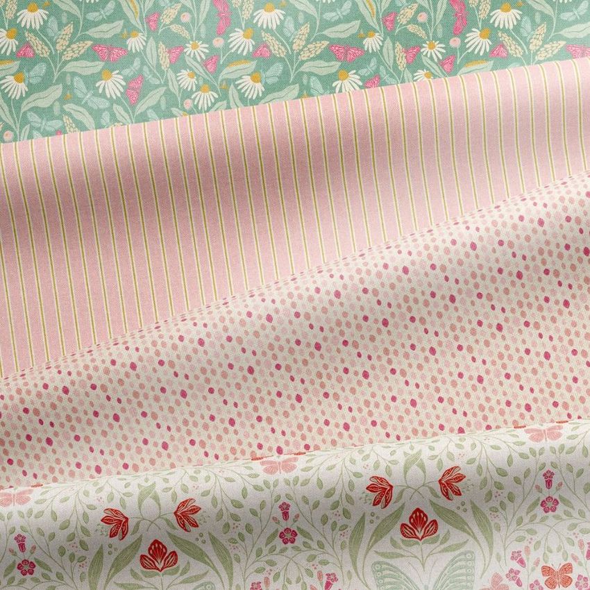 Folded fabrics mockup showing four patterned textile samples with floral, striped, and dotted designs in pastel colors.