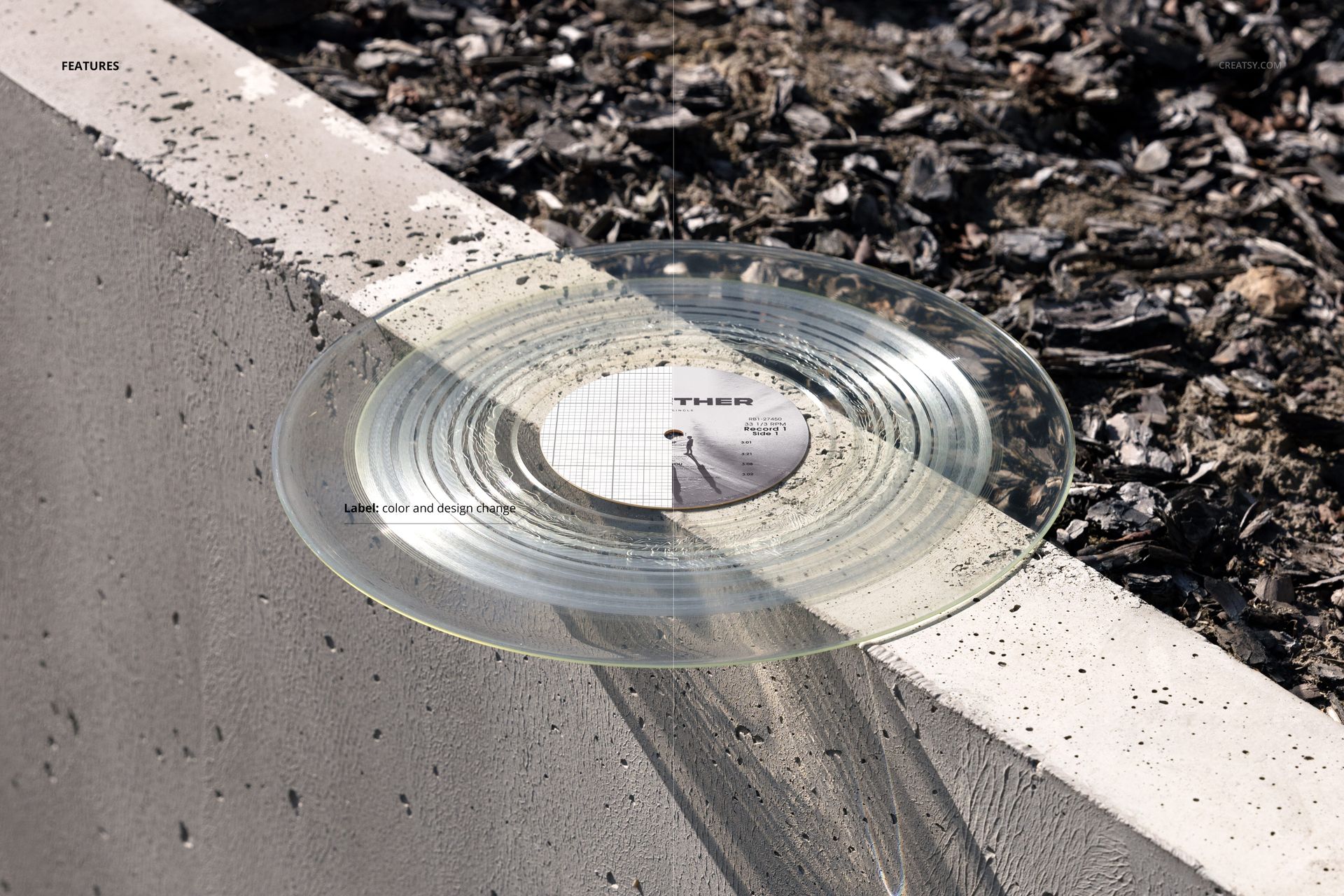 Transparent vinyl record mockup placed on a concrete ledge, surrounded by urban gravel and sunlight reflections.