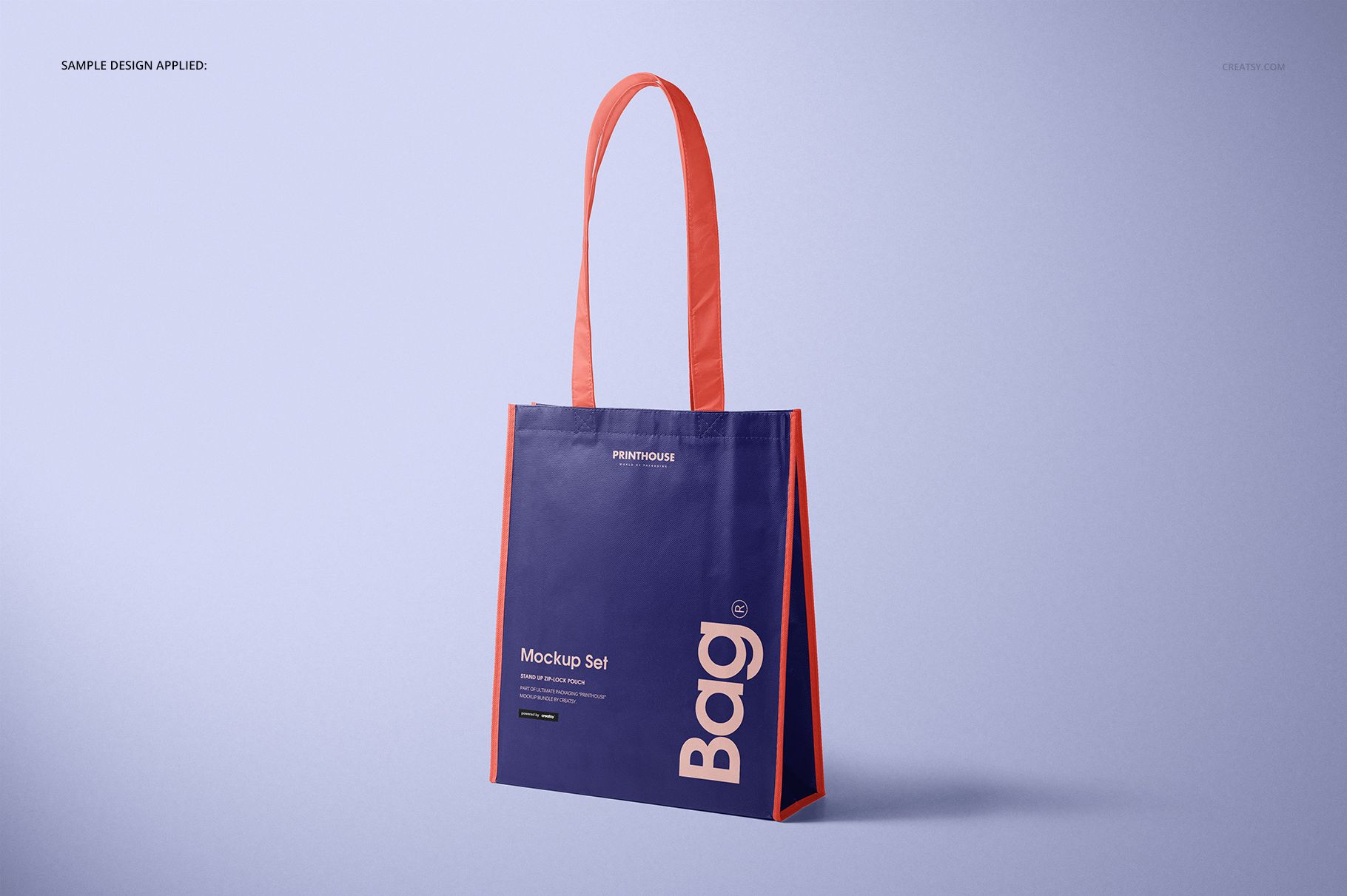 Mockup of a rectangular tote bag with bold typography, featuring a blue body and red side panels on a plain backdrop.