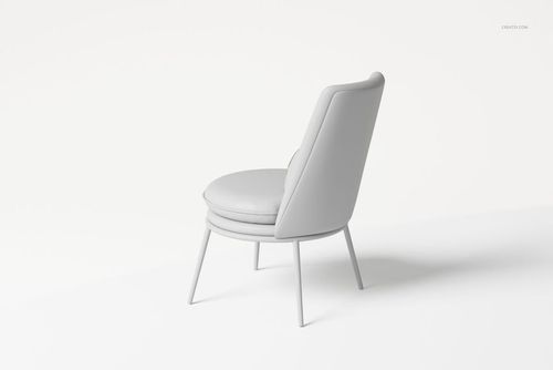 Modern upholstered armchair with a round pillow, shown in a light gray color from a rear side angle view.