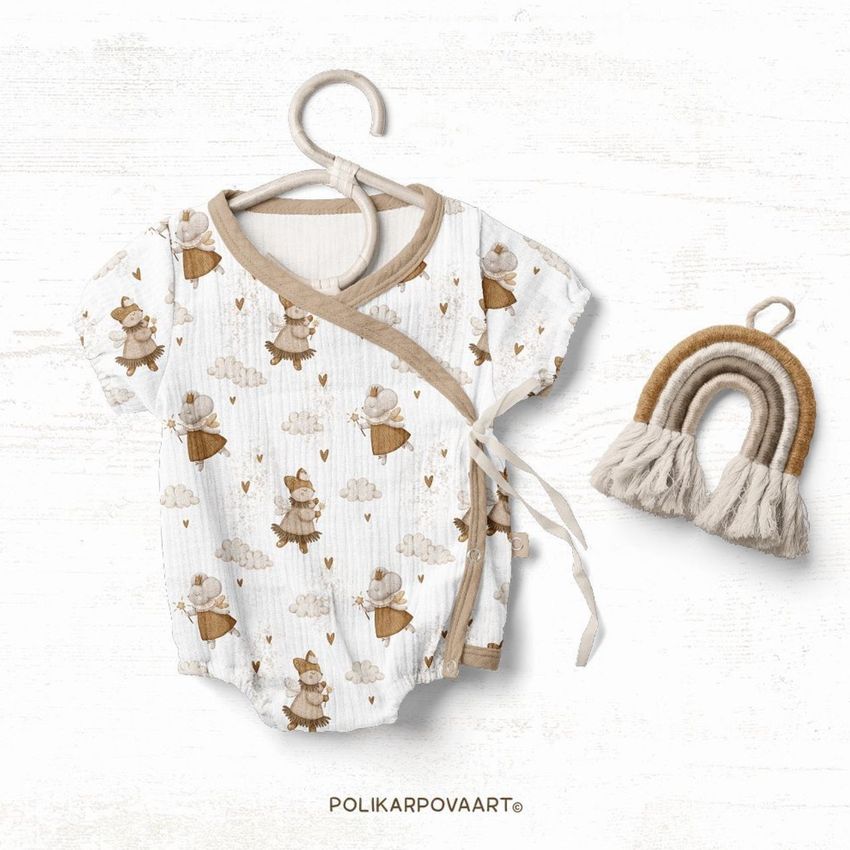 Muslin onesie mockup displayed on a hanger with a whimsical animal and cloud pattern, next to a neutral-toned macrame rainbow.