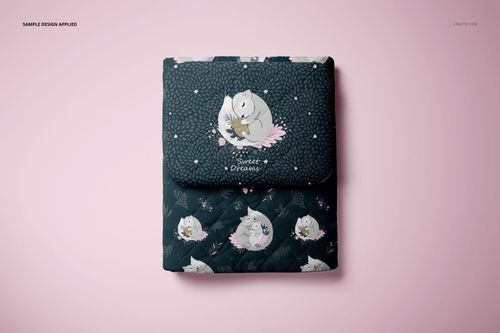 Front view of a double-sided baby bedding set mockup with pillow and quilt, showing cute animal prints and leafy designs.
