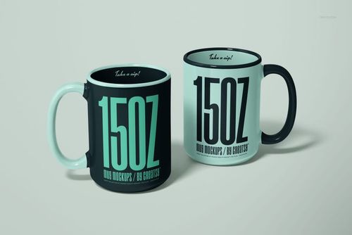 Front view of two 15oz mug PSD mockups featuring prominent typography and color-blocked handles on a neutral background.
