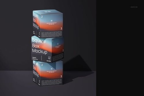 Stack of three square box mockups with a blue and orange gradient pattern, viewed from the front on a dark surface.