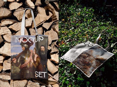 Tote bag mockup with printed artwork, shown hanging on stacked firewood and lying on green grass outdoors.