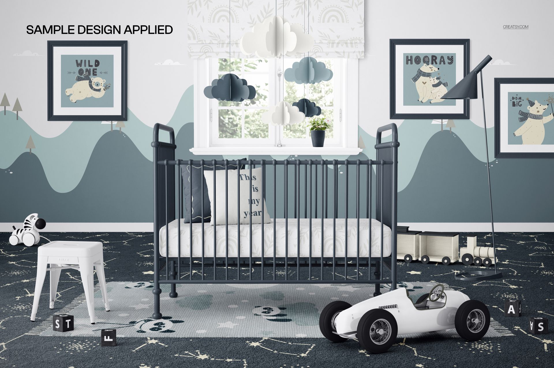 Front view of a vintage metal baby crib in a nursery mockup with cloud mobiles, framed wall art, and toy cars.