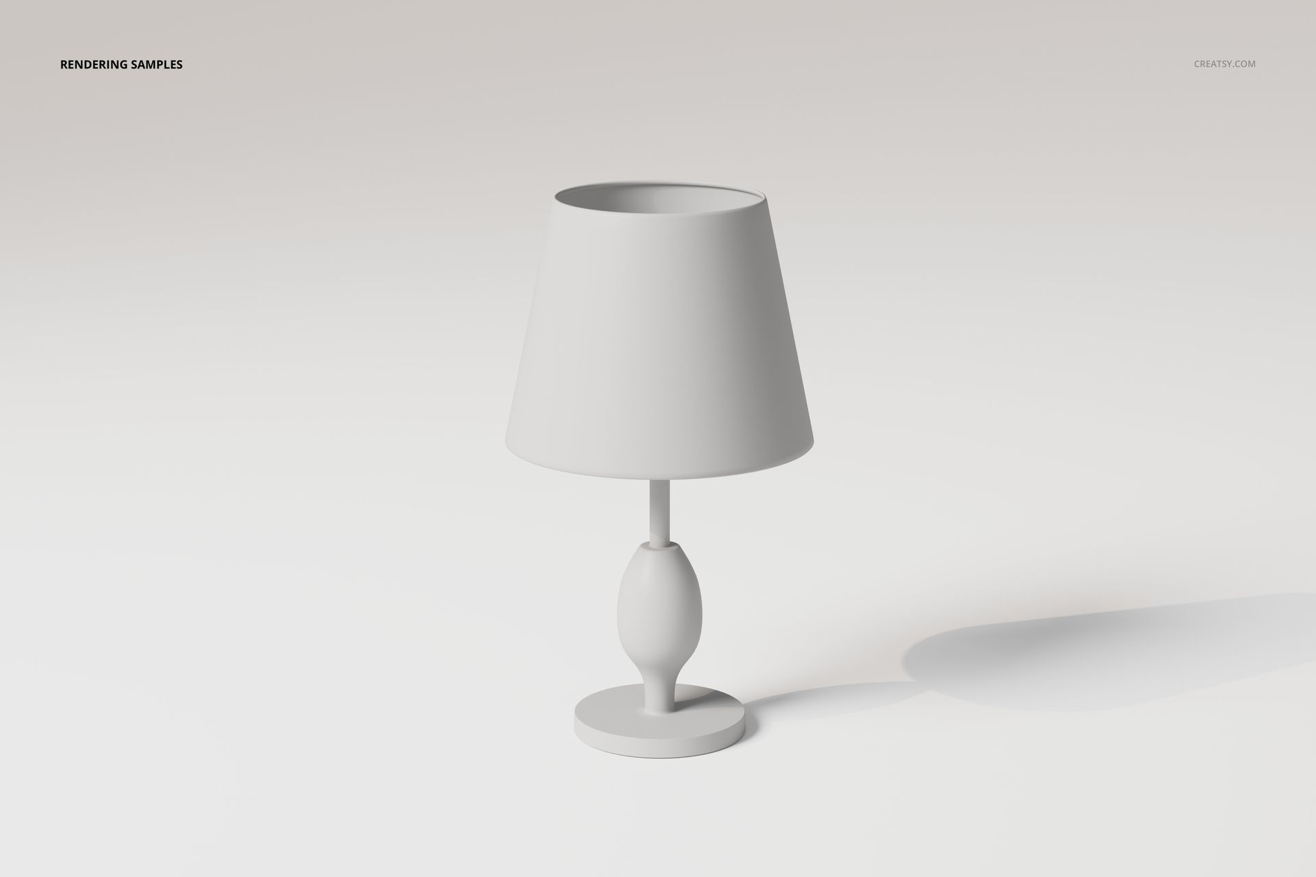 Front view of a simple white fabric shade table lamp with rounded base on a plain light background.