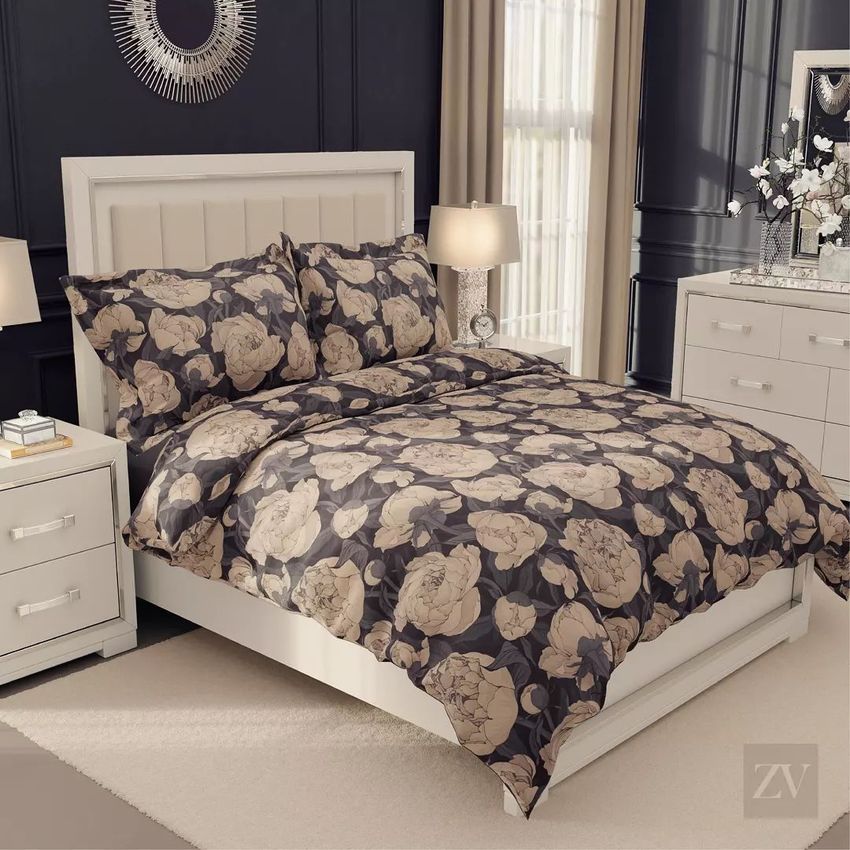 Luxury bedroom bedding mockup showing a bed with flanged pillows and a comforter featuring a large peony floral pattern.