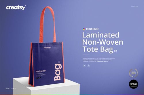 Laminated non-woven tote bag PSD mockup shown with contrasting purple and orange colors against a light blue backdrop.