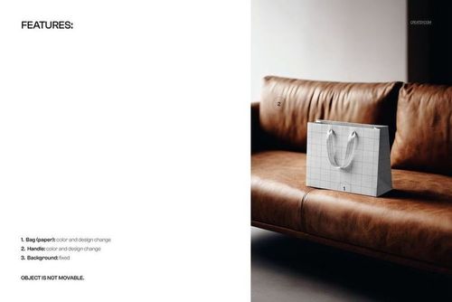 Paper shopping bag with grid pattern mockup placed on a brown leather sofa, front view with soft lighting.