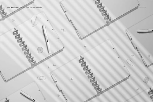 Flat lay of multiple spiral planners mockup with open pages, scattered pens and clips, shown in soft gray shades.