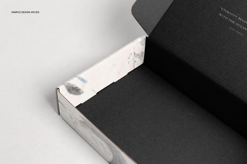 Mailing box mockup with dark inner surface and light marbled edges, displayed with lid partially open.