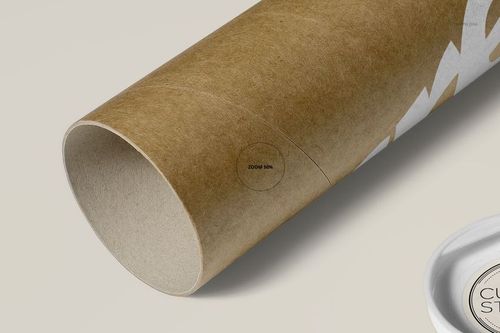 Front angled perspective of a kraft paper mailing tube mockup, featuring partial white zigzag design and neutral setting.