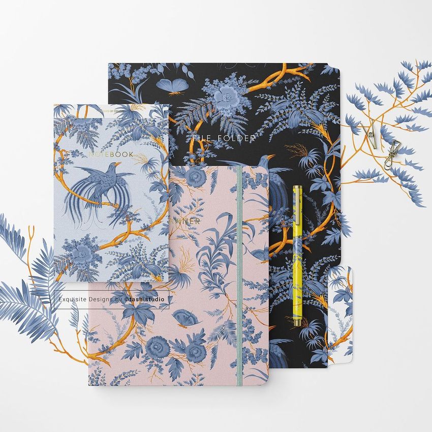 Stationery set mockup featuring a notebook, folder, and pencil with blue and orange botanical patterns on a white background.