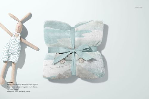 Front view of a 30x40 fleece blanket mockup, ribbon-tied, with light blue and white design beside a plush bunny doll.